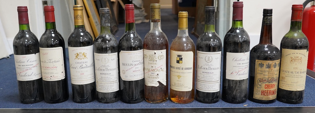 Eleven bottles of wine: Chateau Moulin Hargue 2003 x1, Chateaux Cissac 1982x2, Chateau la Coer Pavillion 1981 x2, Chateaux de barbe 1976 x1, Chateaux Haut Batailly 1998 x1, Premier Cotes de Bordeaux NV x1, Domain de Mart